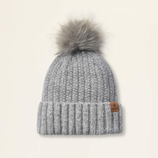 Grey beanie on a beige background