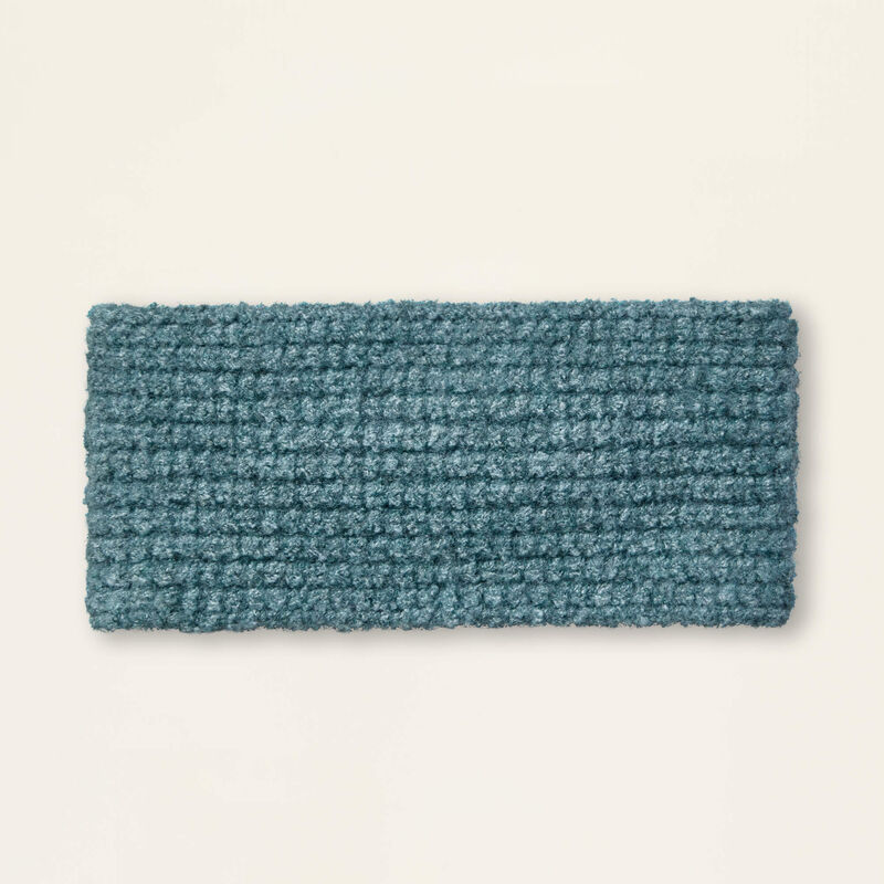 Textured blue headband on a beige background