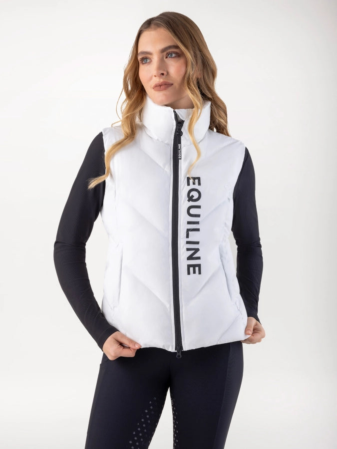 Woman wearing a white vest with 'Equiline' branding on a white background