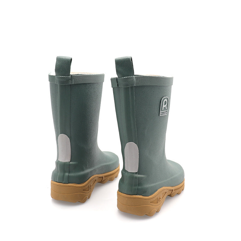 Pair of green rain boots with brown soles on a white background