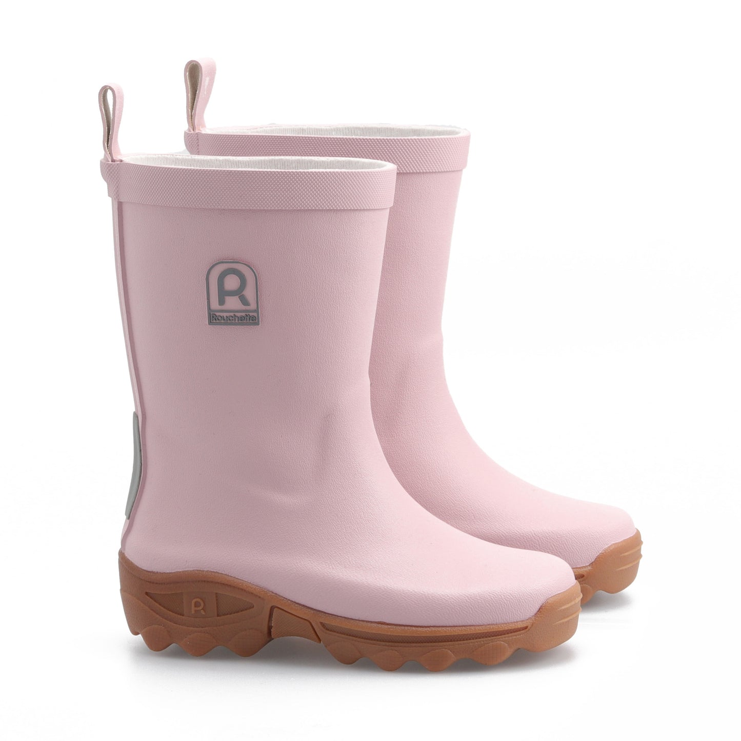 Pair of pink kids wellington boots on a white background