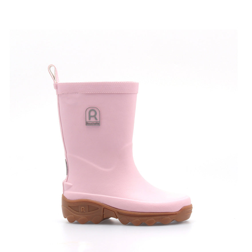 Pink kids wellington boot on a white background