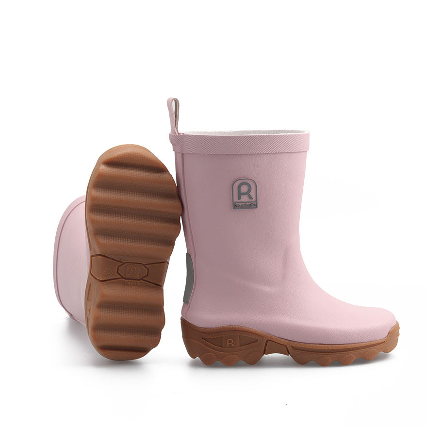 Pair of pink kids wellington boots on a white background