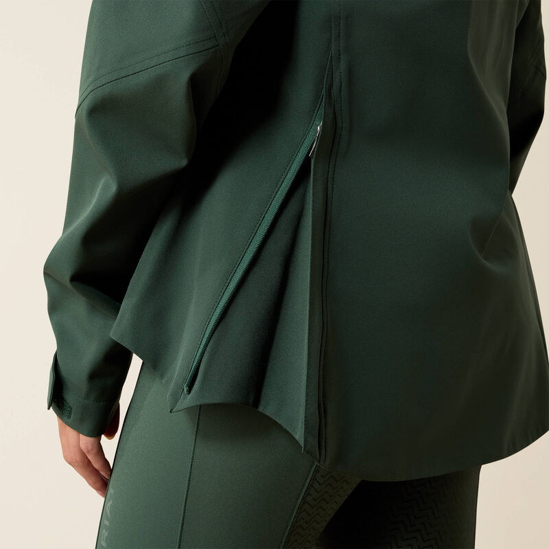 Green coat with a hood on a beige background