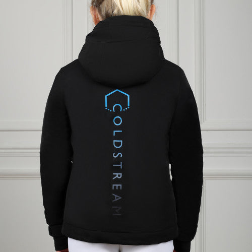 Person wearing a black hoodie with 'Coldstream' logo on the back against a neutral background