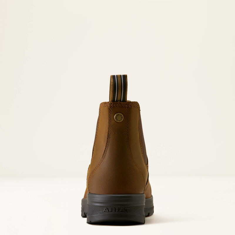 A single brown leather ankle boot shown from the back, featuring a black sole and a striped pull tab at the top, set against a plain off-white background.