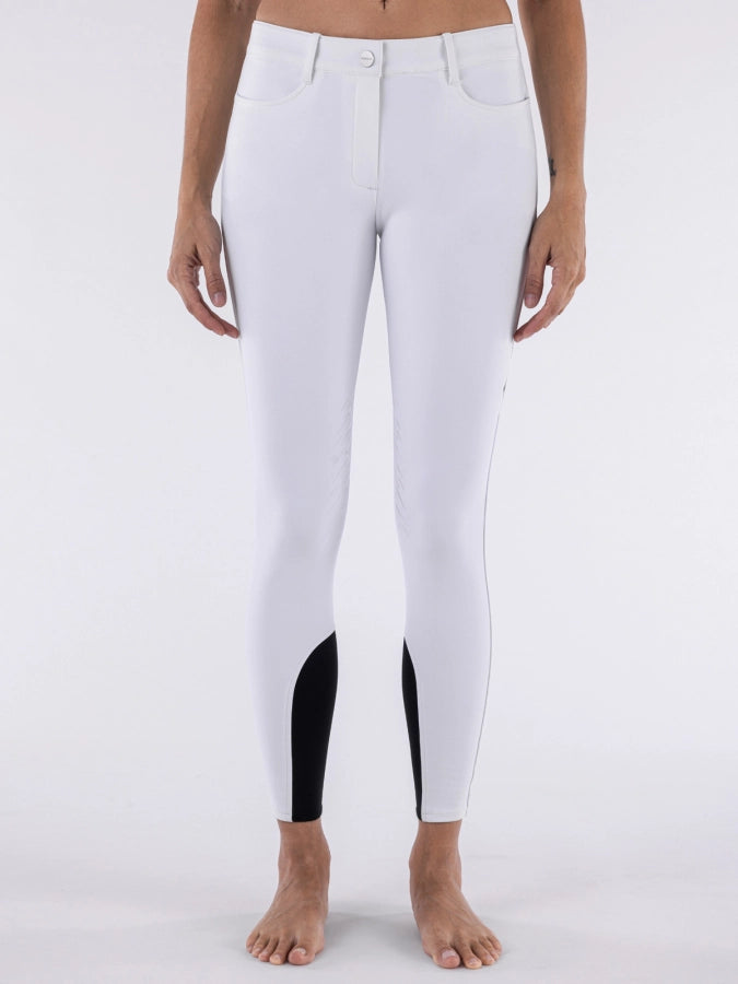 White riding pants with black panels on a white background