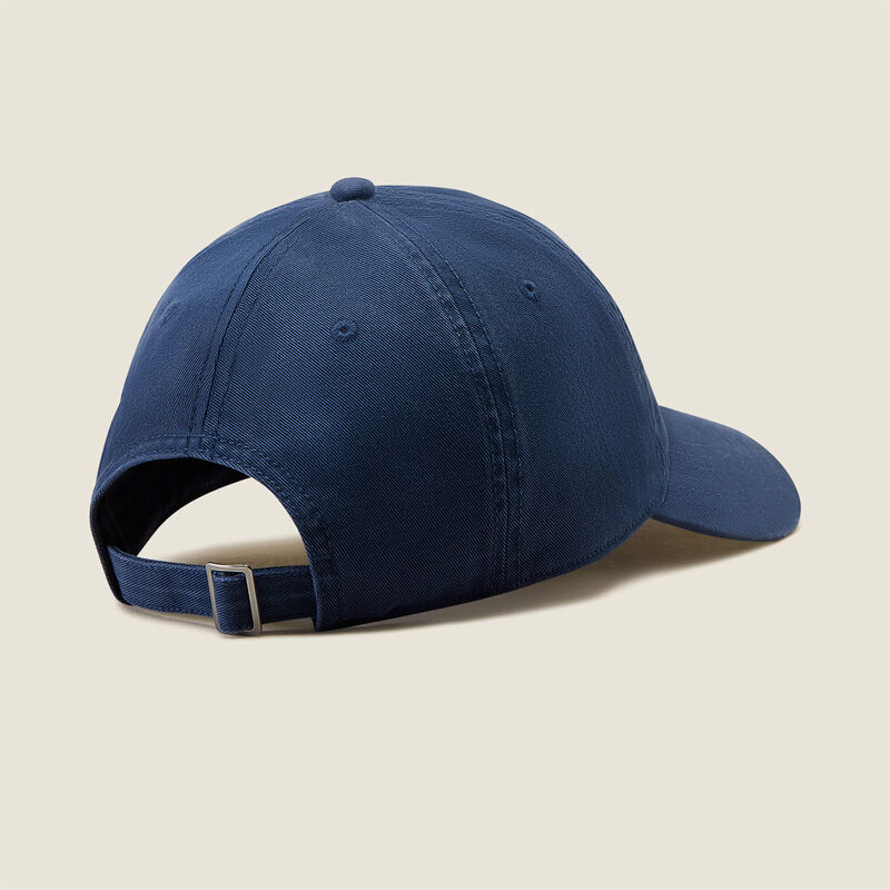 Blue baseball cap on a beige background
