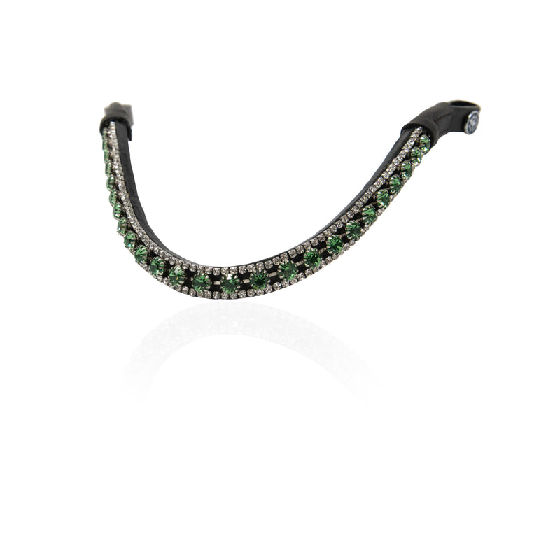 A browband with a black metal base set with rows of green and clear crystals, displayed on a clean white background with a soft reflection.