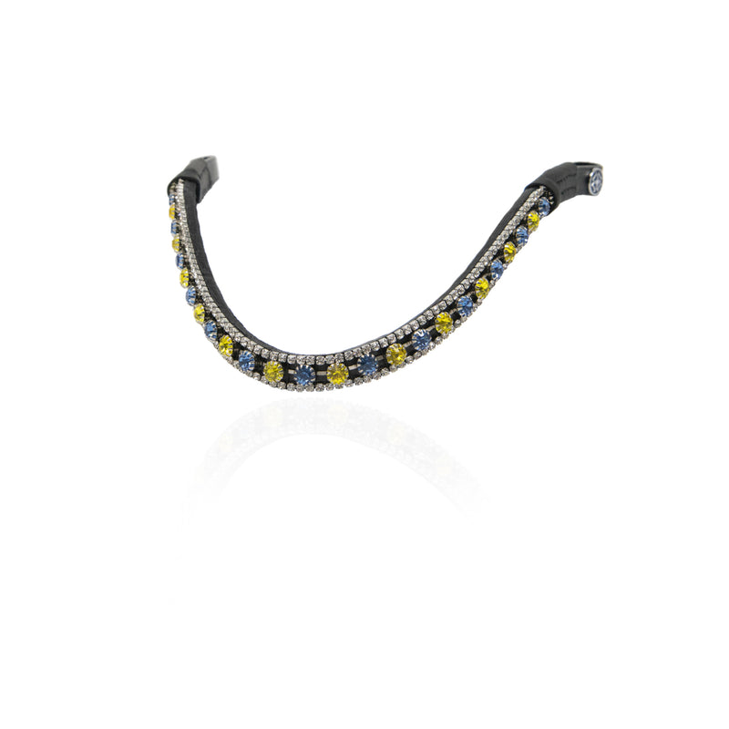 A browband embellished with rows of clear rhinestones and alternating round yellow and blue gemstones on a white background.