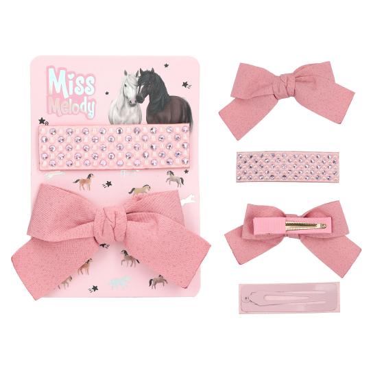 Set of pink hair accessories with packaging featuring 'Miss Melody' on a white background