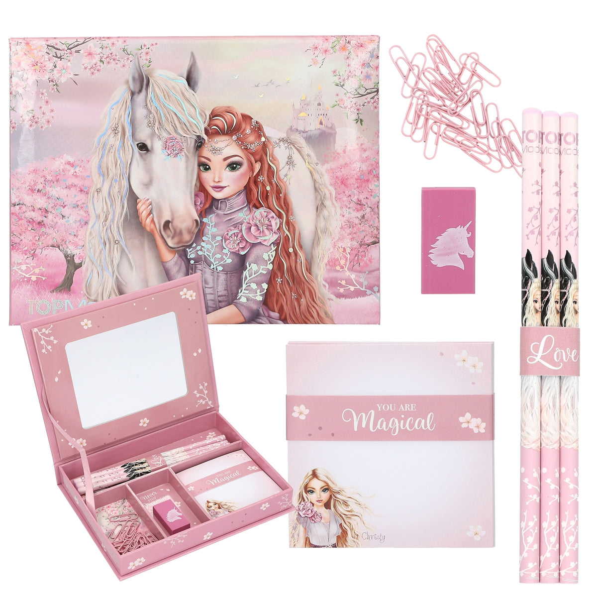 Pink stationery set with a girl and unicorn design, including a mirror, notepad, and hair accessories.