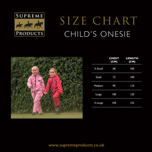 Size chart for children's onesies with two children in pink and red onesies standing in front of a hedge.