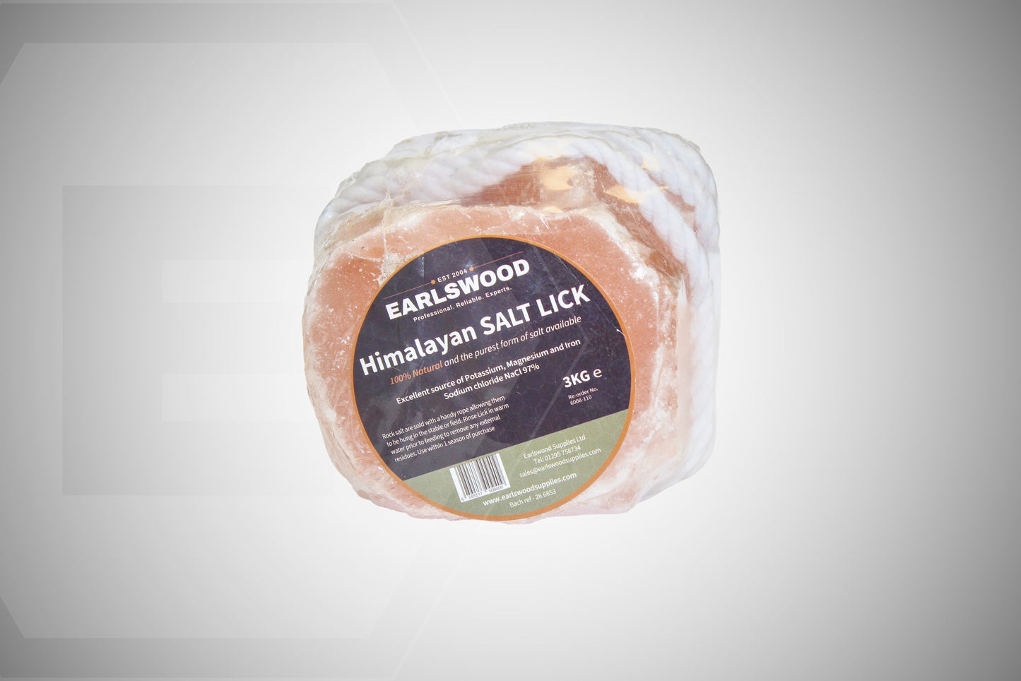 A packaged round product labeled 'Earlswood Himalayan Salt Lick' in clear wrapping with a dark circular sticker, shown on a light gray background.