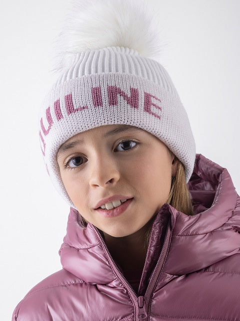 Girl wearing a white hat and a pink jacket against a white background