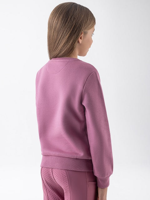 A child model shown from the back wearing a dusty pink crewneck sweatshirt and matching textured pants against a plain white studio background.