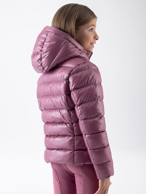 Girl wearing a pink jacket on a neutral background