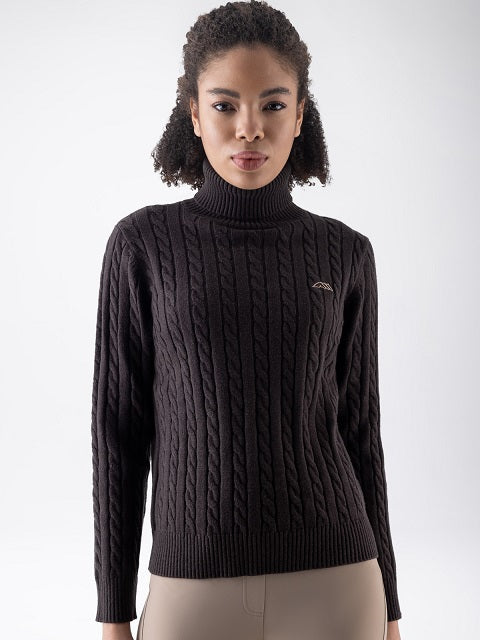 Woman in a brown pullover on a neutral background