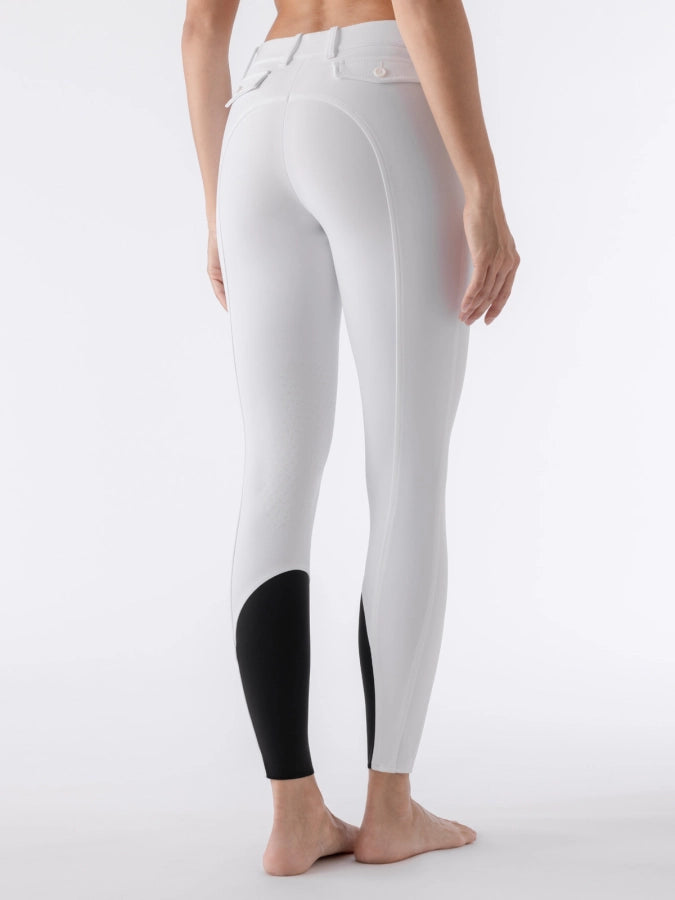 White breeches with black sock bottoms worn by a person on a white background