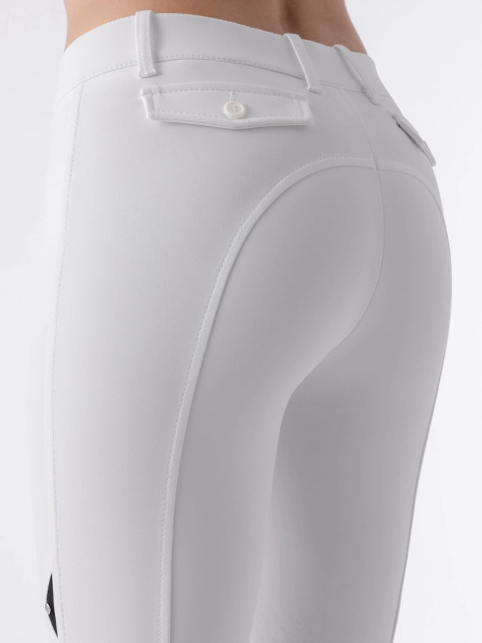 White riding pants with a button pocket on a white background