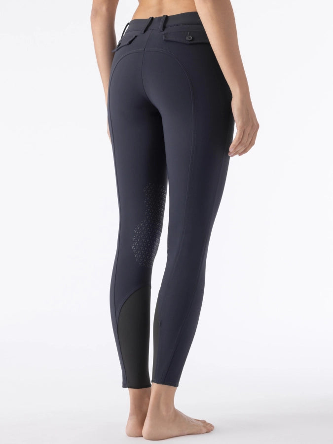 Navy breeches worn by a person on a white background