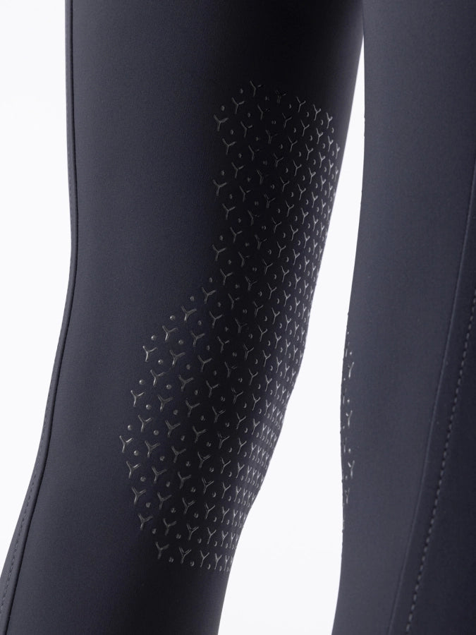 Navy leggings with a knee grip on a white background