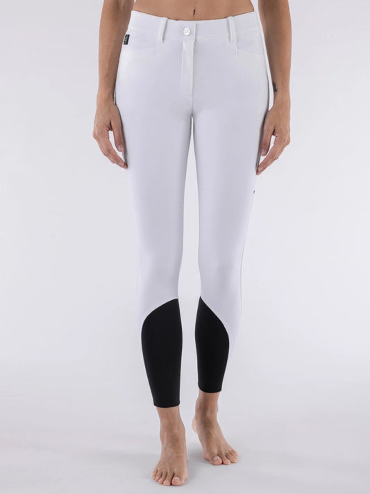 White riding pants with black cuffs on a white background