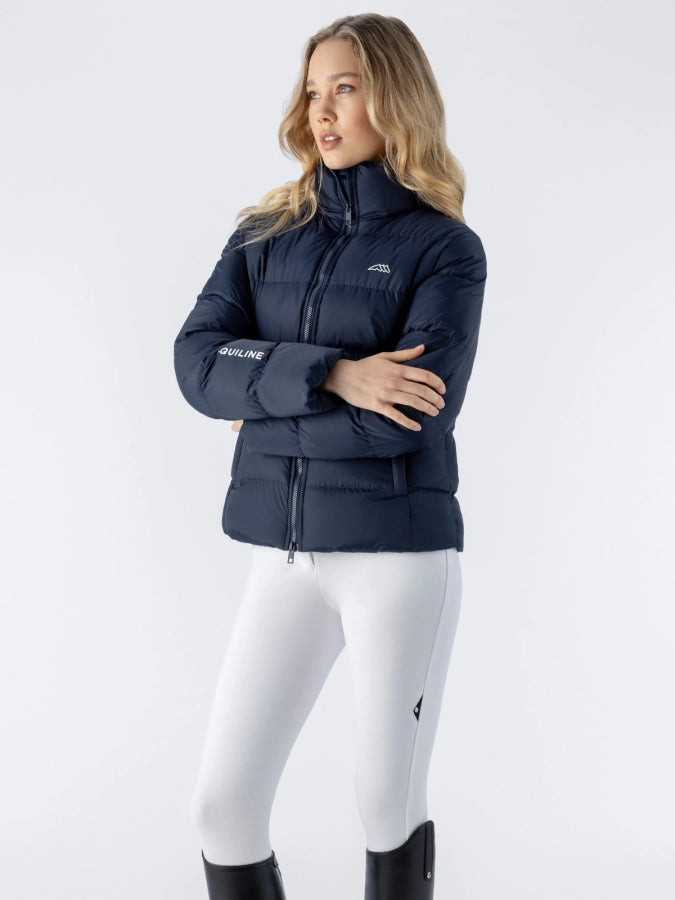 Woman wearing a navy blue jacket with a brand logo on a white background