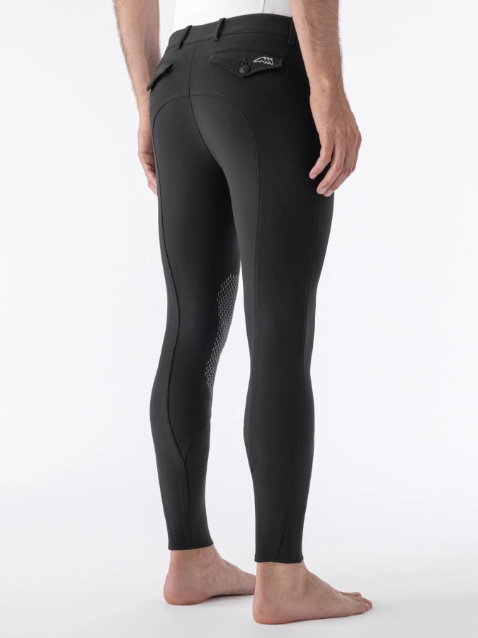 Black riding pants on a white background