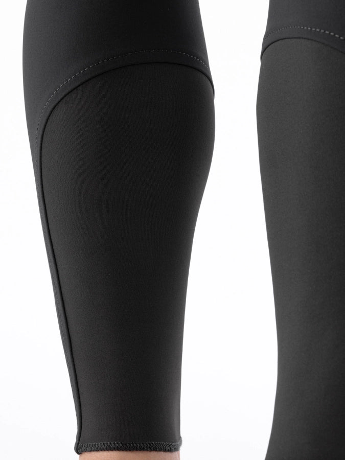 Black sock bottoms of breeches on a white background