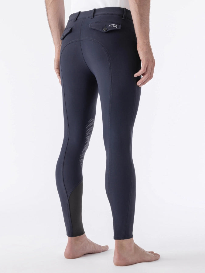 Navy riding pants with a brand logo on a white background