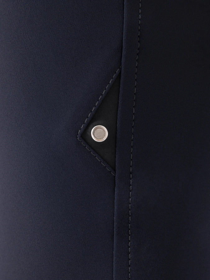Close-up of a navy blue fabric with a button detail