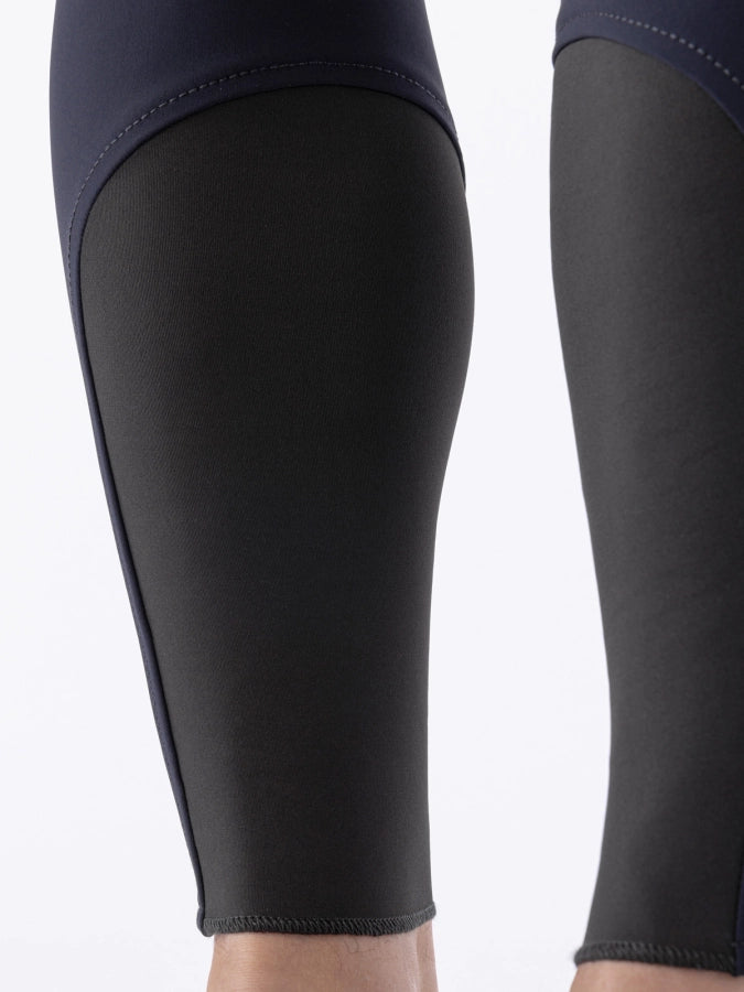 Black sock bottoms of breeches worn by a person on a white background