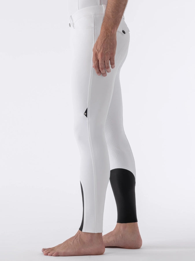 White equestrian pants with black accents on a white background