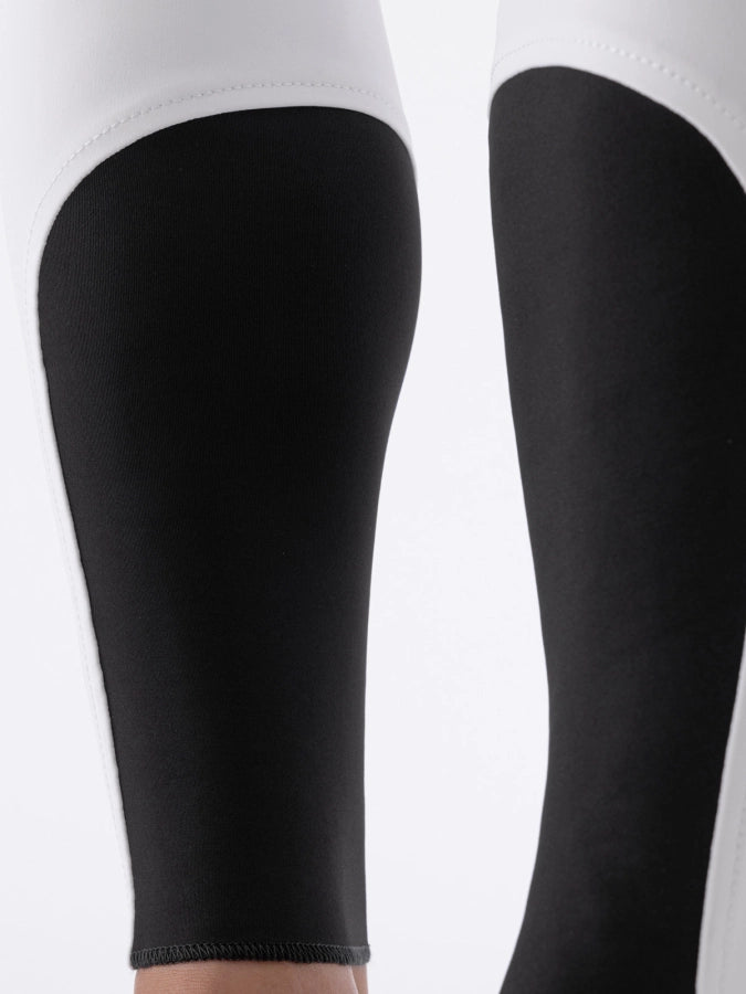 Black sock bottoms of breeches on a white background