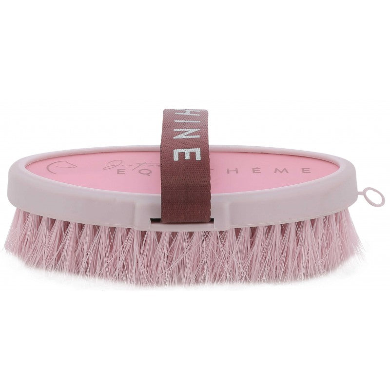 Pink horse brush with a brown handle on a white background