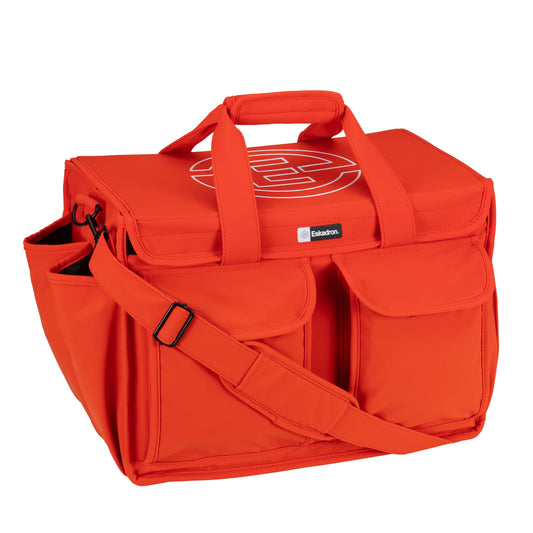 Bright orange cube accessories bag on a white background