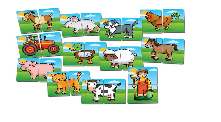 Game of farm animal and tractor cards on a grassy background