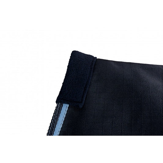 Close-up of a black fabric with a blue stripe on a white background