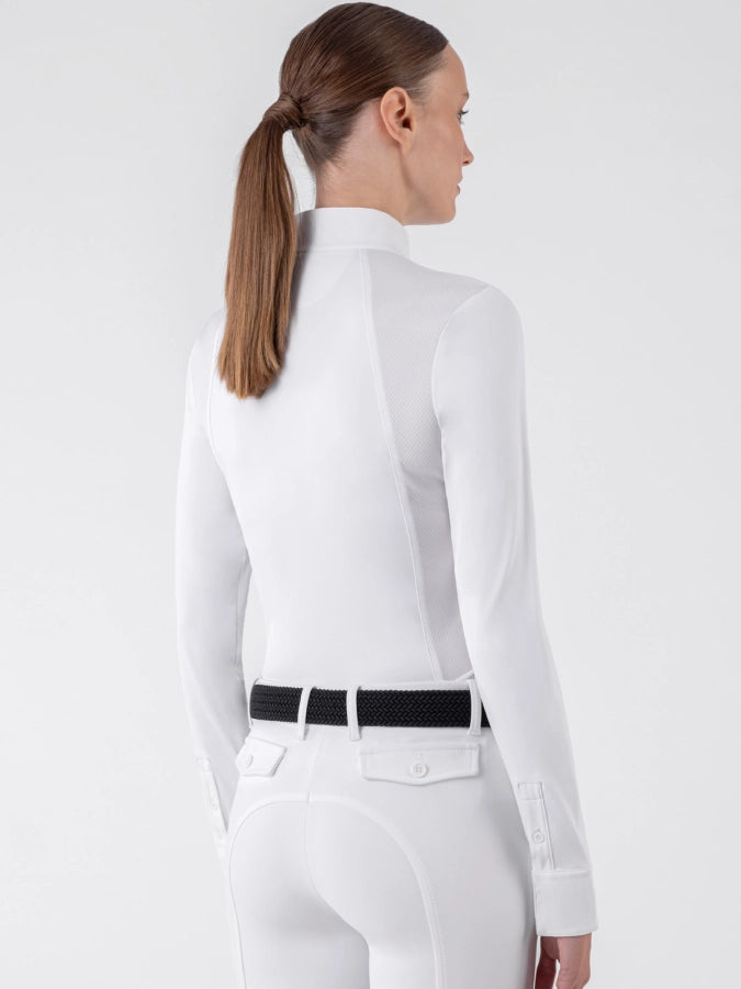 Woman wearing a white blouse with a black belt on a white background