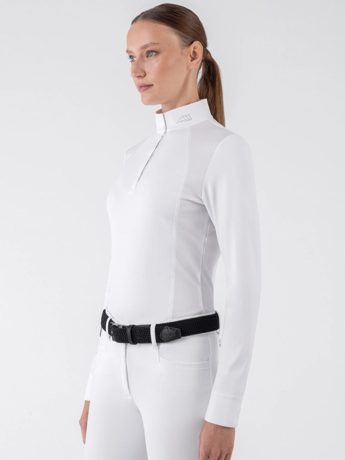 Person wearing a white equestrian jumpsuit with a black belt on a white background