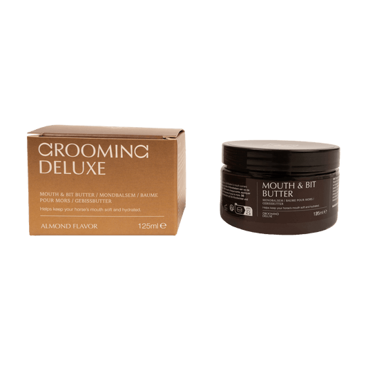 A box and jar of Grooming Deluxe Mouth & Bit Butter in almond flavor, shown on a solid black background.
