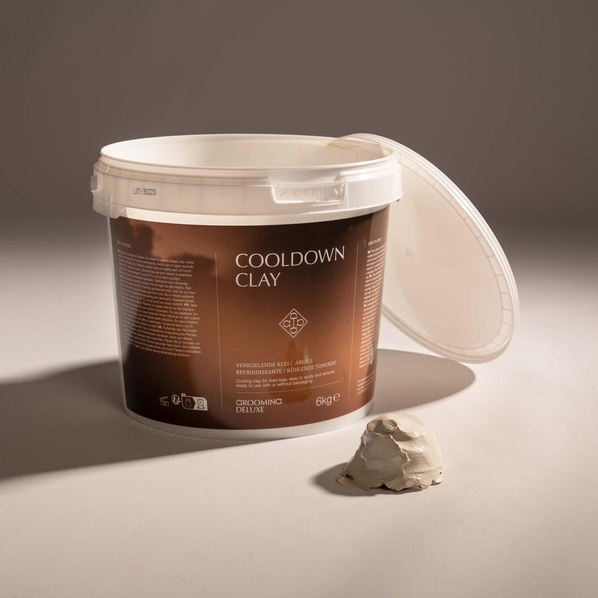 Container of Cooldown Clay with a small amount on a surface