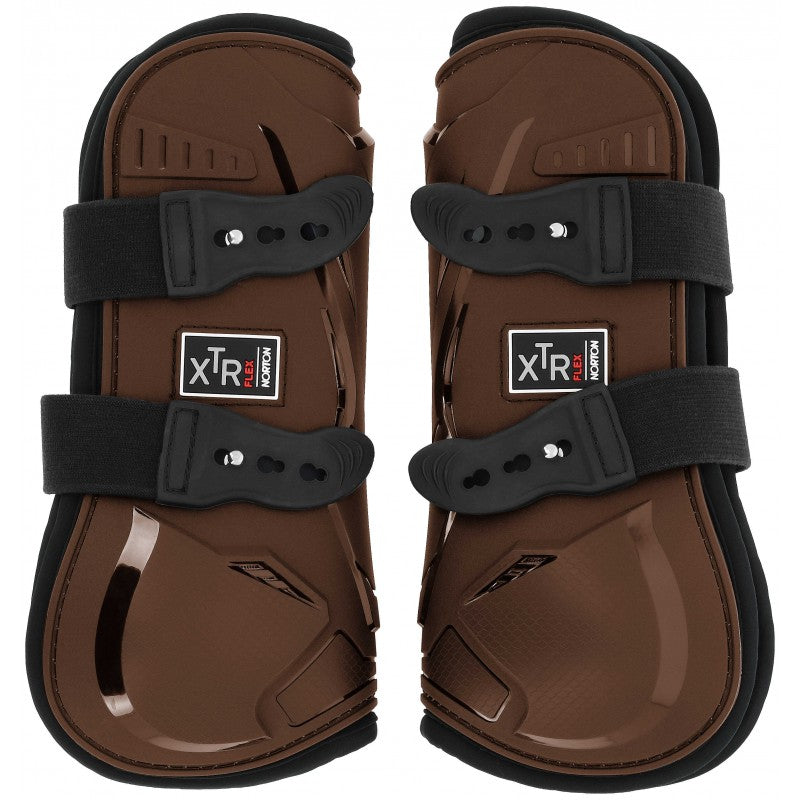 Pair of brown protective horse boots with black straps on a white background