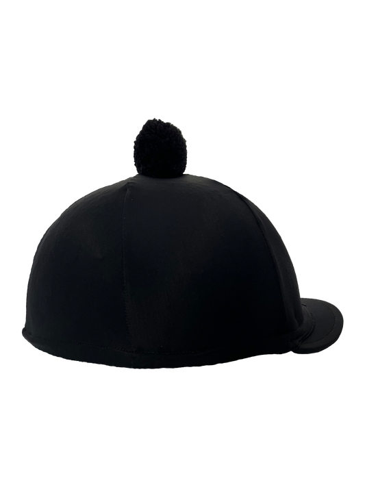 Black riding helmet with a pom-pom on a white background
