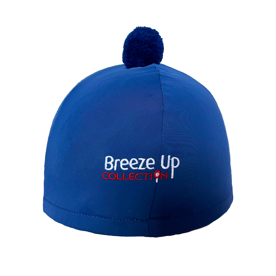 Blue helmet with pom-pom and 'Breeze Up Collection' text on a white background