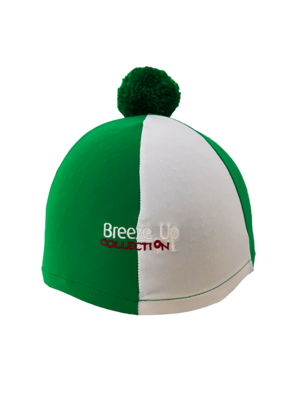Green and white hat silk with a pom-pom on a white background