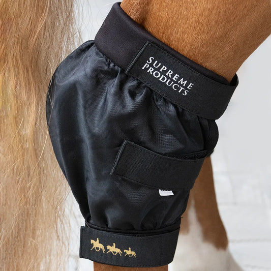 Black protective boot on a horse's leg with 'Supreme Products' branding.