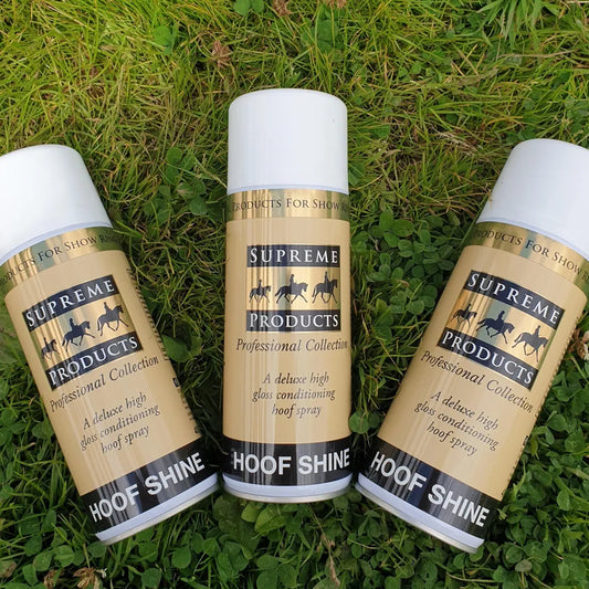 Three bottles of Supreme Products Hoof Shine on grass