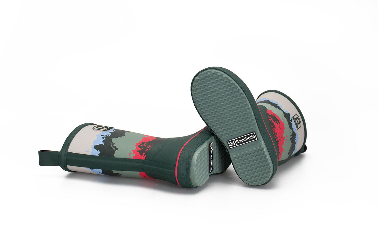 Pair of green kids wellington boots lying on their side on a white background